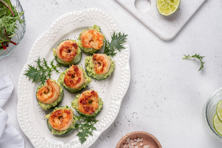 Shrimps, cucumber and avocado guacamole, party food, finger foodの写真素材