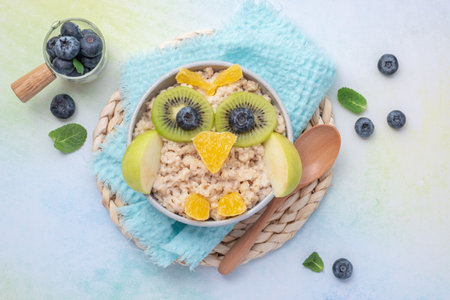 Kids breakfast porridge with fruitsの写真素材