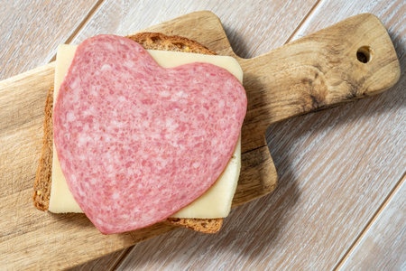 Heart shape sandwich with salami and cheeseの写真素材