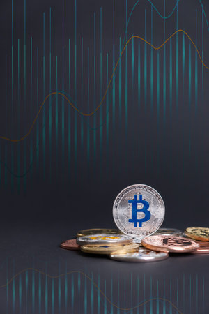 Bitcoin silver coin color with the logo in Blue color, standing on many digital coins, in a grey...