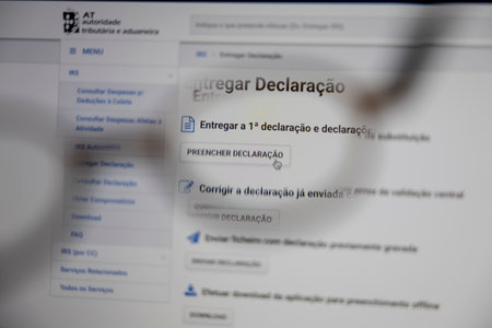 Azores, Portugal - 07.04.2023: Portuguese IRS - "AT Autoridade Tributaria e Aduaneira" Official Website, with Fill Button for IRS Statement "Preencher Declaracao"のeditorial素材