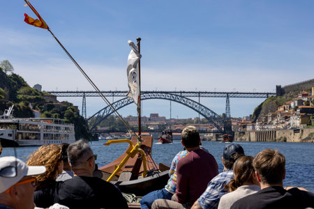 Porto, Portugal - 02.04.2023: Tourists on a boat tour on the Douro River. Porto, Portugal.のeditorial素材