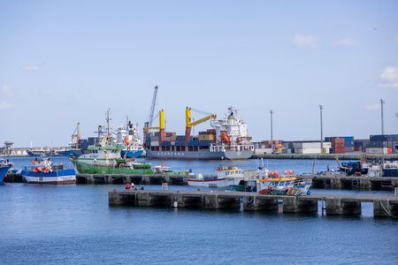 Ponta Delgada, Azores - 10.06.2023: Cargo ships and fishing boats in the port Ponta Delgada in the Island of Sao Miguel in the Azores.のeditorial素材