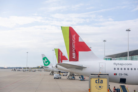 Porto, Portugal - 31.05.2023: Tale of two Airplanes from TAP - Air Portugal - in the Porto Airport. TAP is Portuguese Flag Aviation Company.のeditorial素材
