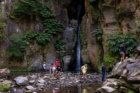 Ribeira Grande, Azores - 05.09.2019: Tourists standing near the Waterfall of "Salto do Cabrito". Sao Miguel island in the Azoresのeditorial素材