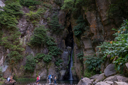 Ribeira Grande, Azores - 05.09.2019: Tourists standing near the Waterfall of "Salto do Cabrito". Sao Miguel island in the Azoresのeditorial素材
