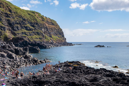 Ferraria, Azores - 04.09.2019: Bathers at Ferraria on a beautiful summer day. Thermal waters at Ponta da Ferraria, thermal waters in the sea hot water. Sao Miguel island in Azoresのeditorial素材