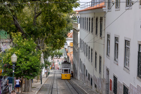 Lisbon, Portugal - 18.09.2023 The Gloria Funicular (Elevador da Gloria) on the typical street in the city center of Lisbon, Portugalのeditorial素材