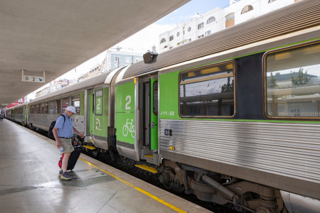 Lisbon, Portugal - 20.09.2023: Tourist entering the Train of the CP (Comboios de Portugal) at the...