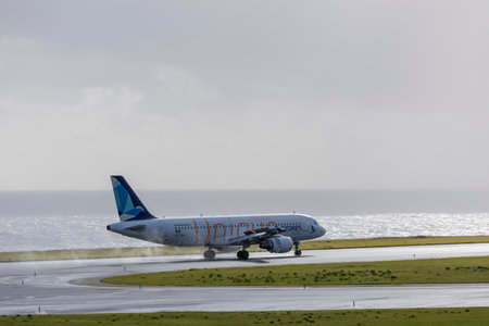 Ponta Delgada, Azores - 28.03.2024: Landing Airbus A320 plane - Unique - from Sata Azores Airlines in Joao Paulo II Airport in Ponta Delgada, Sao Miguel island, Azores.のeditorial素材