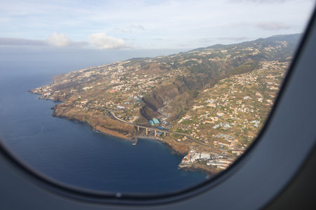 View from the window of an airplane to Madeira's island shore. Madeira island Portugalの写真素材
