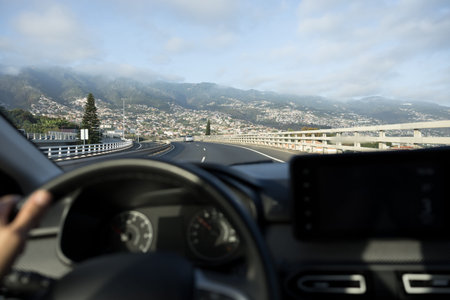 Driver POV view to Madeira island traffic road. Car Dashboard blurred. Madeira Island, Portugal