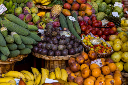 Variety of local typical fruits at the Farmers Market (Mercado dos Lavradores) in Funchal. Madeira island, Portugalの写真素材
