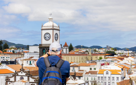 Tourist taking a picture to the historic center of Ponta Delgada, SÃ£o Miguel Island, Azores, Portugal.の写真素材