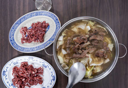 Close up view of Chinese hotpot with sliced taiwan beef and vegetables in Taiwan. Most popular and delicious food in winter in Taiwan.の写真素材