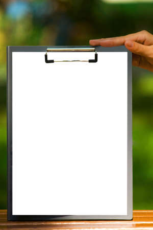 The clipboard in the handの写真素材