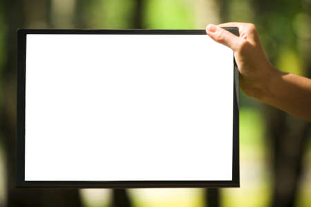 The white sheet of paper on the clipboard in the handの写真素材