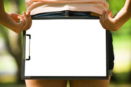 The white sheet of paper on the clipboardの写真素材