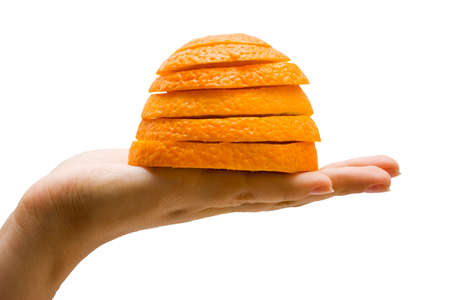 The hand and the orange on the whiteの写真素材