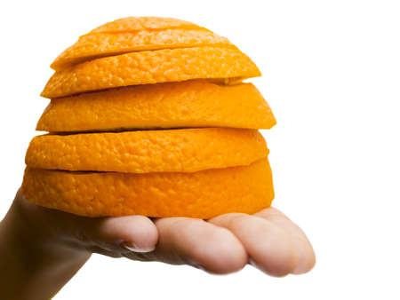 The hand and the orange on the whiteの写真素材