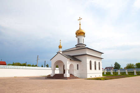 Orthodox cathedral with golden domes in a small townの写真素材