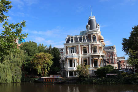 House on the canal with boatのeditorial素材