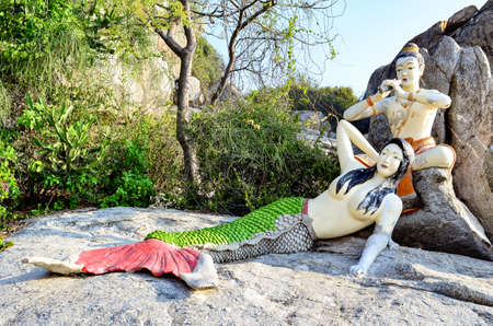 Mermaid statue on the nearby beach. Prachuap Khiri Khan, Thailandの写真素材