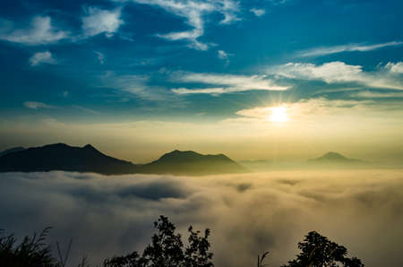 Sunrise and fog over Phu Thok Mountain at Chiang Khan ,Loei Province in Thailand.の写真素材