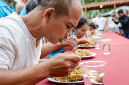 NAKHONRATCHASIMA, THAILAND - MARCH 02, 2013: Championship eat chow mein Korat.のeditorial素材