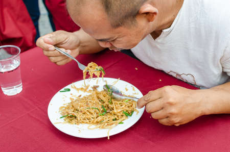 NAKHONRATCHASIMA, THAILAND - MARCH 02, 2013: Championship eat chow mein Korat.のeditorial素材