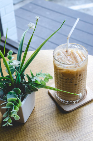 Iced coffee on a wooden table brown.