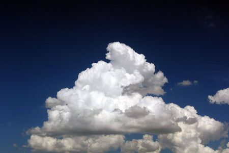 Fluffy, cotton-like clouds on the sky.の写真素材