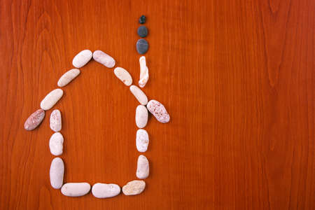 Home from stone on wood textureの写真素材