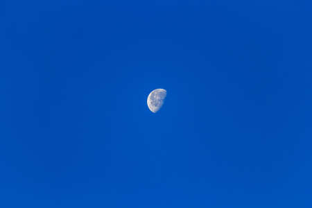 Clear blue sky with the moon backgroundの写真素材