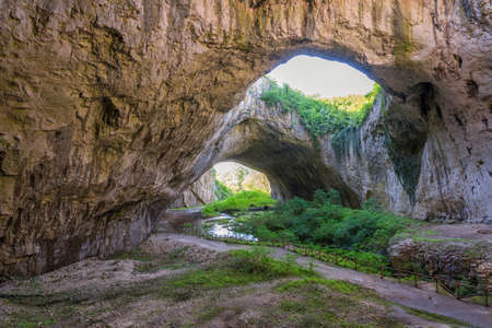 Magnificent view of the Devetaki cave, Bulgaria at summerの写真素材