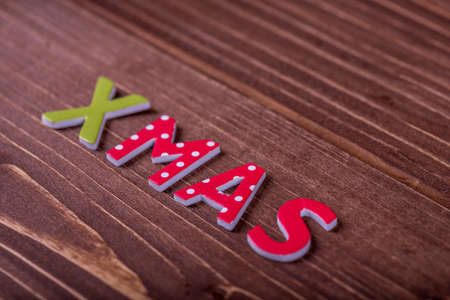 Christmas greeting card on a wooden table.の写真素材