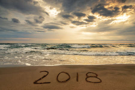 Happy New Year 2018 concept on the sea beach; sunrsie shot.の写真素材