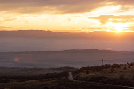 Scenic view of landscape against cloudy sky.