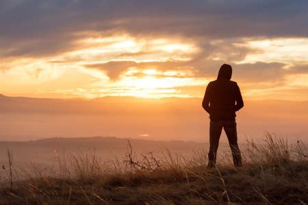 Tourist on the mountain top. Sport and active life concept.の写真素材