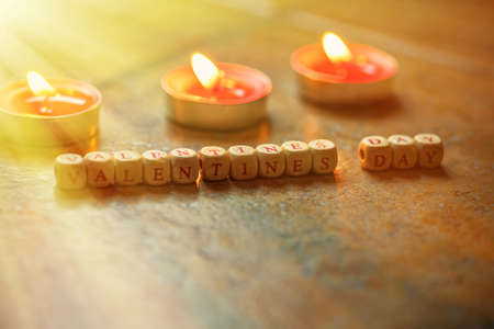 The Word Happy Valentineâs Day wooden cubes on a wooden background.の写真素材