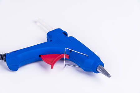 New white glue gun. Studio shot isolated on white.の写真素材