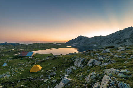 Sunset landscape with Kamenitsa peak and Tevno lake, Pirin Mountain, Bulgaria.の写真素材