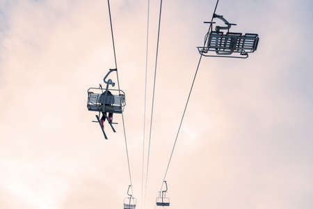 Ski lift against sky. Sheregesh ski resort. Active winter holidays.の写真素材