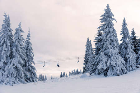 Ski lift against sky. Sheregesh ski resort. Active winter holidays.の写真素材
