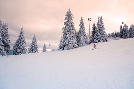 Sunset in Ski resort , Bulgaria. Beautiful view at mountain. Winter sports and relaxation.の写真素材