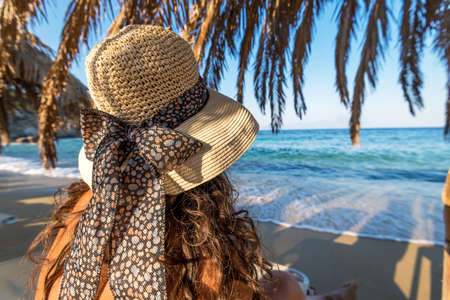 Tourists on summer vacations relaxing on the beach.