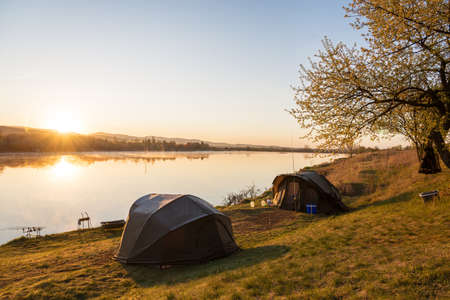 Fishing adventures, carp fishing.  Camping on the shore of the lake.の写真素材