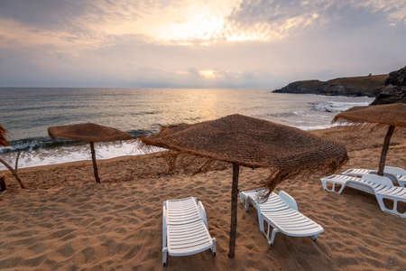Waves at sunset at mediterranean sea.の写真素材