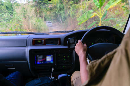 Driving 4wd off road in tropical forest.