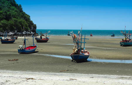 Wooden fishing boat on a sandy beachの写真素材